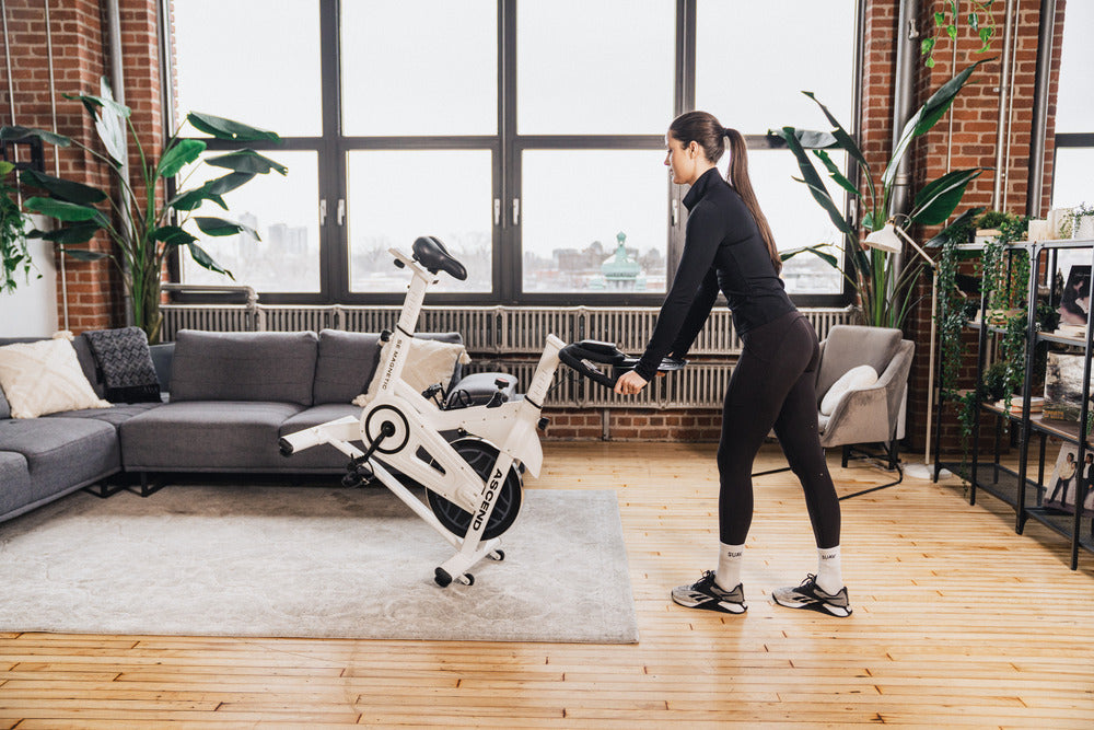 Woman wheeling spin bike