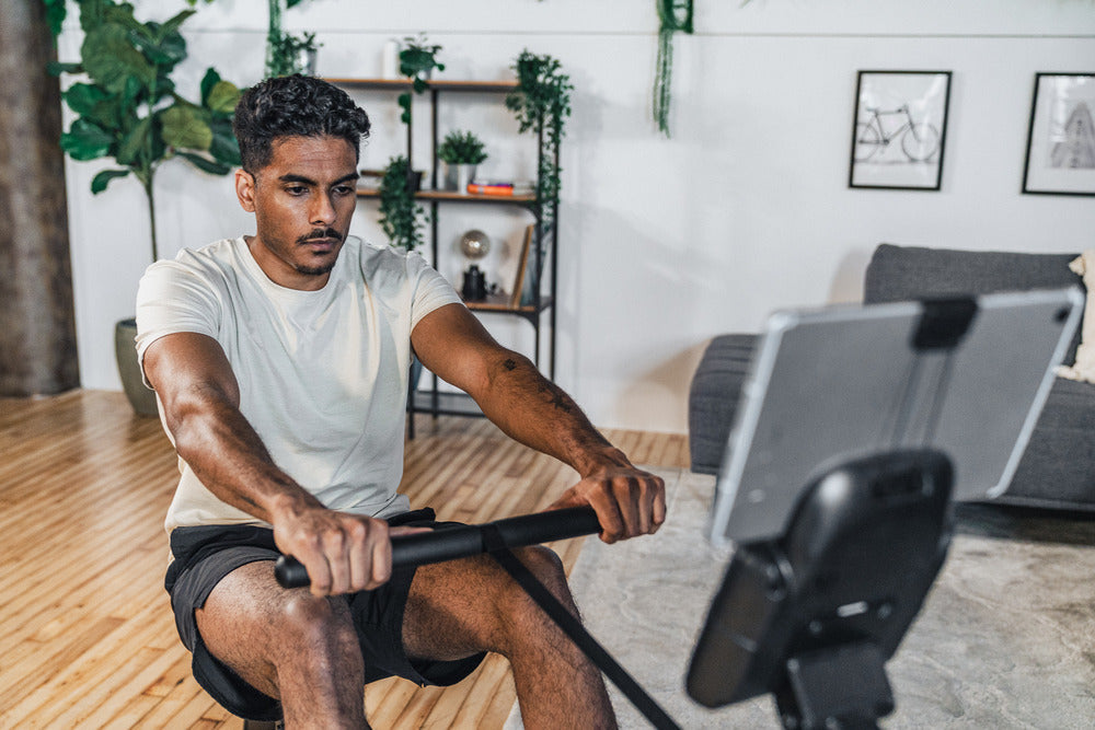 man on rowing machine