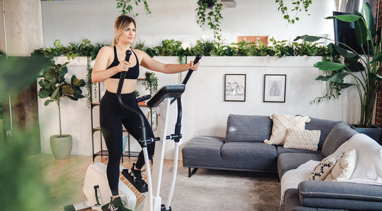 woman working out on elliptical